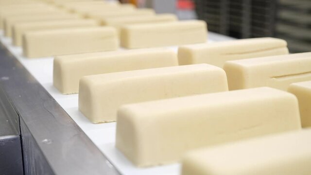 Molded Marzipan blocks rolling of a factory production line