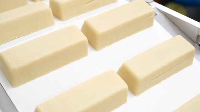 Molded Marzipan blocks rolling of a factory production line