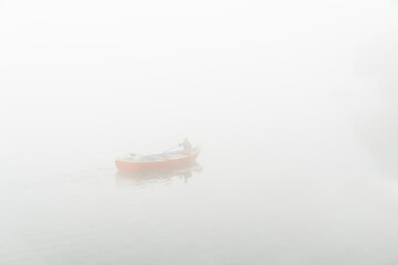 rowing boat in a fog