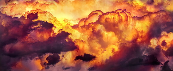 colorful dramatic sky with clouds, smoking cumulonimbus clouds reflect the golden light of the dawn sun. 
