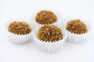 Homemade honey balls with nuts - delicious energy protein sweets, white background