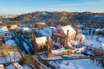 Aerial winter sunny frozen day view of snowy Vilnius old town, Lithuania