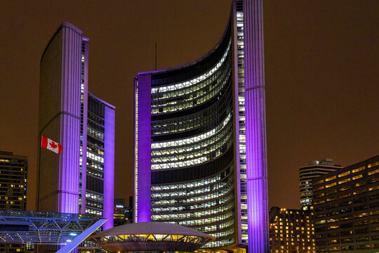 The New City Hall illuminated during the Cavalcade of Lights festival in Toronto Canada