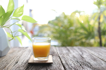 Mango juice on wooden table