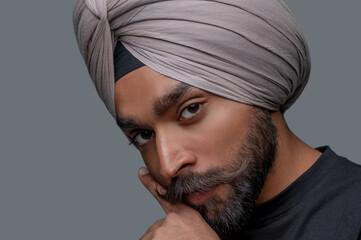Tranquil man in the turban posing for the camera