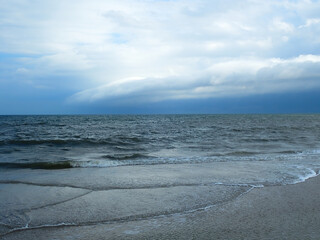 ocean under a sky with clouds