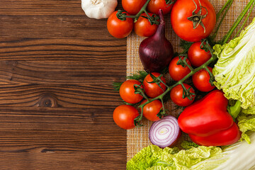 fragrant tomatoes on a wooden table. cherry tomatoes. top view. copy space.