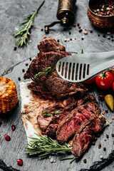 Medium rare sliced grilled striploin beef steak. Restaurant menu, dieting, cookbook recipe top view