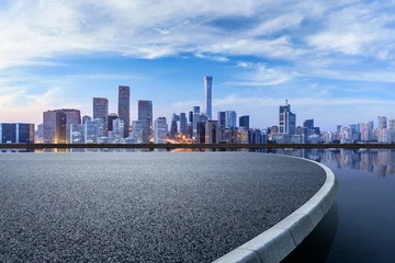 Fototapeten Panoramic skyline and modern commercial buildings with empty circular square in Beijing, China. © ABCDstock