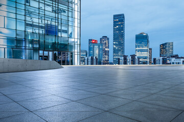 Fototapeta premium Panoramic skyline and modern commercial office buildings with empty square floors in Beijing at night