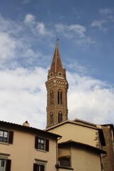 Fototapeta na wymiar Bell Tower of the Badia Fiorentina (Abbazia di Santa Maria, Abbey), ancient church in Florence downtown, in Gothic and Baroque style. Tuscany, Italy, Europe.