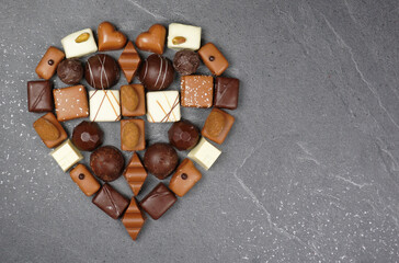 Handmade or homemade chocolate or bon bon. A heart of chocolate. love for valentine, mothersday or...