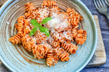  Home made italian   radiatori bolognese fresh   pasta  on rustic background. Mediterranean food concept