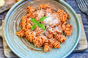  Home made italian   radiatori bolognese fresh   pasta  on rustic background. Mediterranean food concept