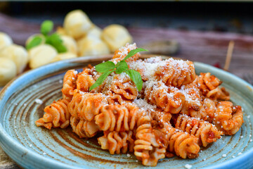  Home made italian   radiatori bolognese fresh   pasta  on rustic background. Mediterranean food concept