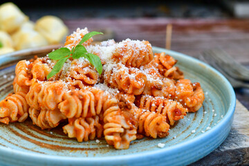 Home made italian   radiatori bolognese fresh   pasta  on rustic background. Mediterranean food concept