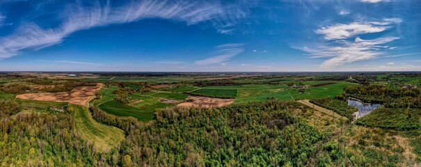 panorama landscape with fresh forest blue sky and clouds