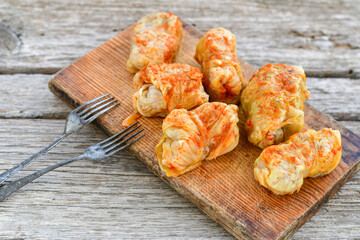 Cabbage rolls with meat, rice and vegetables. Stuffed cabbage leaves with  ground beef. Known as sarma, golubtsy, dolma.