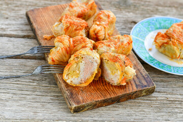 Cabbage rolls with meat, rice and vegetables. Stuffed cabbage leaves with  ground beef. Known as sarma, golubtsy, dolma.