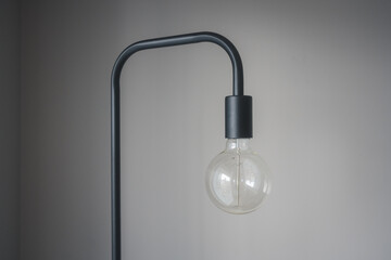 Obraz premium Minimalistic Norwegian Style Black Floor Lamp with Big Light Bulb 