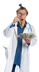 a young guy in a medical gown holds dollars and examines them through a magnifying glass. opened his mouth with delight. focus on money. crazy doctor