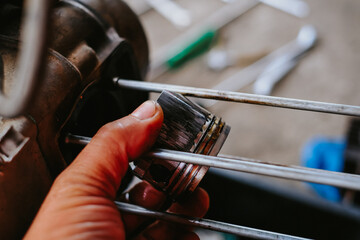 Damaged piston of a motorcycle engine.