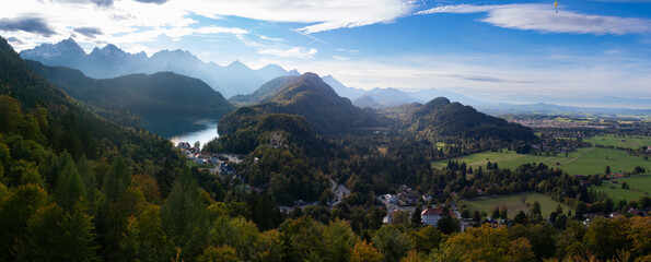 View from Iconic Neuschwanstein Castle during Autumn With Changing Leaves Overlooking historic village and Hohenschwangau Castle
