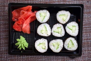 cucumber rolls delivery from rkstoran. kappa maki on a black plate