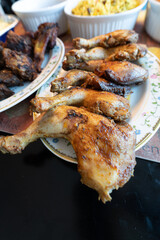 Grilled chicken thighs ready to eat on a buffet