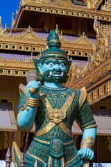 Fototapeta premium Colorful stone statue of a guard in a Buddhist temple in Myanmar, Burma
