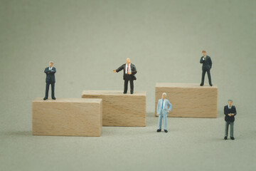 Group miniature businessman of investor standing various position