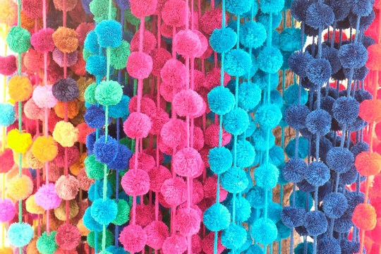 Strands of colorful pom poms. Todos Santos, Mexico