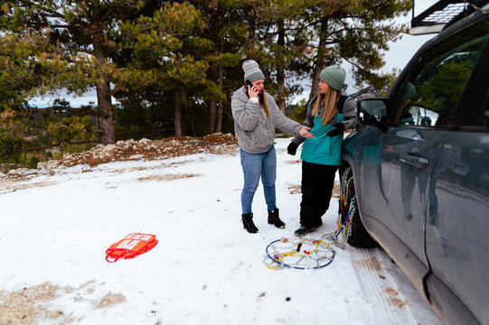 Troubled woman calling to car service near stuck auto