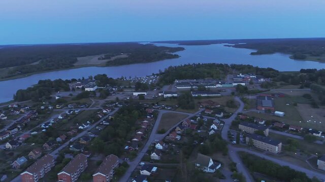 Gamleby village during the blue hour with baltic sea and houses illuminated