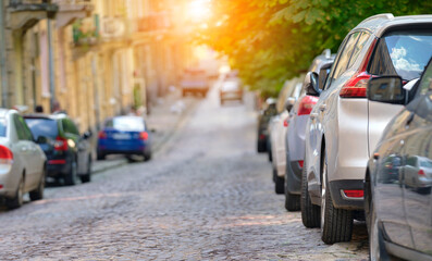 City traffic with cars parked in line on street side