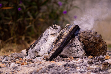 burning cigarette on the fire