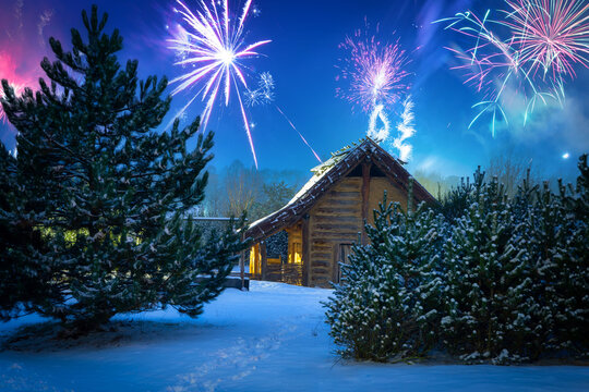 New Year's Eve fireworks display over the winter hut in the woods