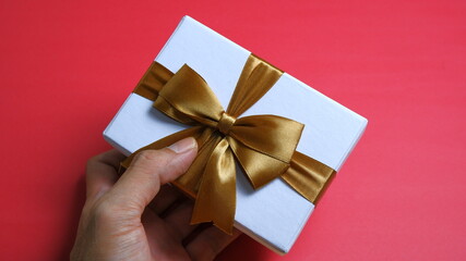 White gift box with gold ribbon. valentine concept, christmas concept, newyear concept. anniversary concept.