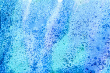 Abstract watercolor blue-turquoise gradient texture with stains and salt crystals. Watercolor background.