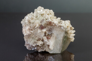 macro mineral stone Apophyllite stilbite on a gray background