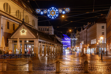 Street in Augsbug decorated with christmals lights