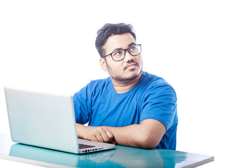 office man wearing glass using laptop and looking at side
