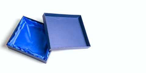 Gift boxes of blue color on a white background. The concept of space