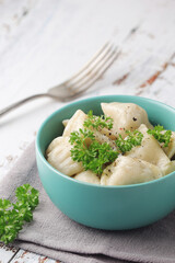 Russian national dish pelmeni served in a plate