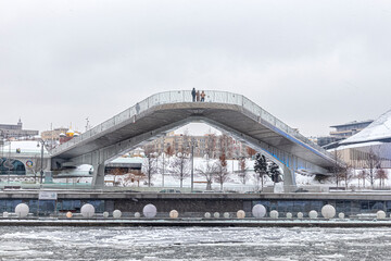 Floating bridge in Zaryadye Park in winter in a snowfall