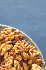 Close up picture of walnuts in a bowl, shallow depth of field.