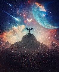 Fantastic creature with angel wings on the top of a mountain against marvelous cosmic sky background. Surreal scene with a celestial messenger or space guardian watching the horizon