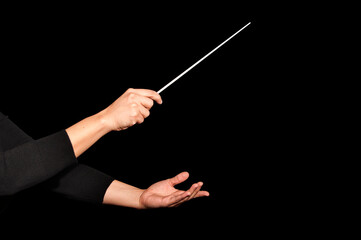 Orchestra woman conductor music conducting. Hands of conductor with baton on black background