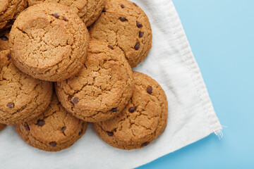 Oatmeal cookies on a napkin on a blue background