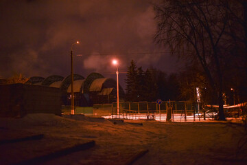 A park of the city at night in winter